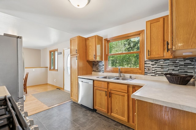 22658 Martin Lake Dr NE, Stacy, MN 55079 - kitchen with stainless steel appliances, healthy amount of natural light, light countertops, and tasteful backsplash