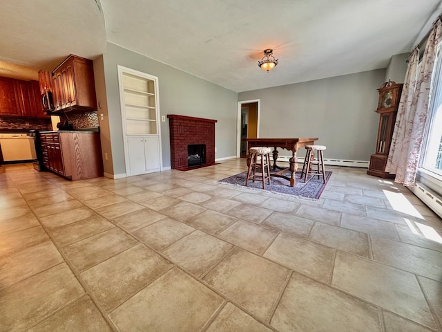300 Lyon St, Minneota, MN 56264 - dining area with a brick fireplace, built in shelves, and a baseboard heating unit