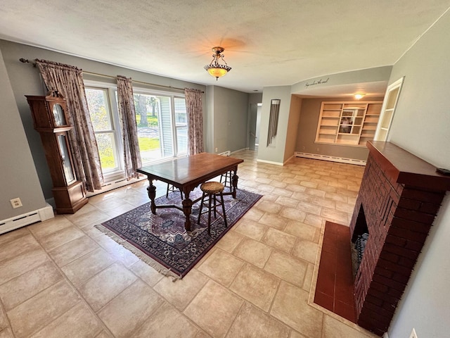 300 Lyon St, Minneota, MN 56264 - dining space featuring baseboard heating, built in features, and a fireplace