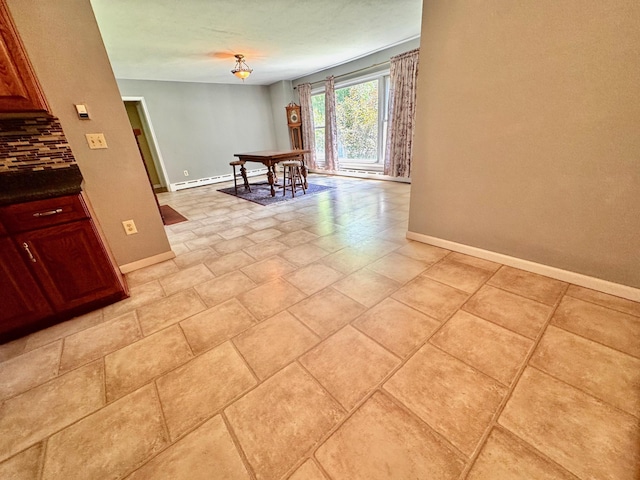 300 Lyon St, Minneota, MN 56264 - unfurnished room featuring baseboards and a baseboard heating unit