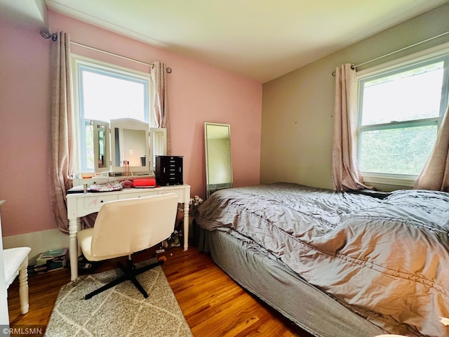 10701 6th St NE, Blaine, MN 55434 - bedroom with multiple windows and wood finished floors