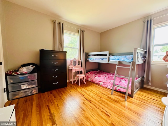 10701 6th St NE, Blaine, MN 55434 - bedroom featuring wood finished floors