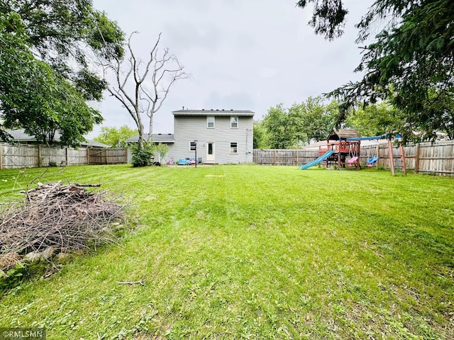 10701 6th St NE, Blaine, MN 55434 - fenced backyard featuring a playground
