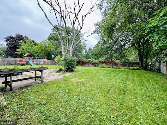 10701 6th St NE, Blaine, MN 55434 - fenced backyard with a playground