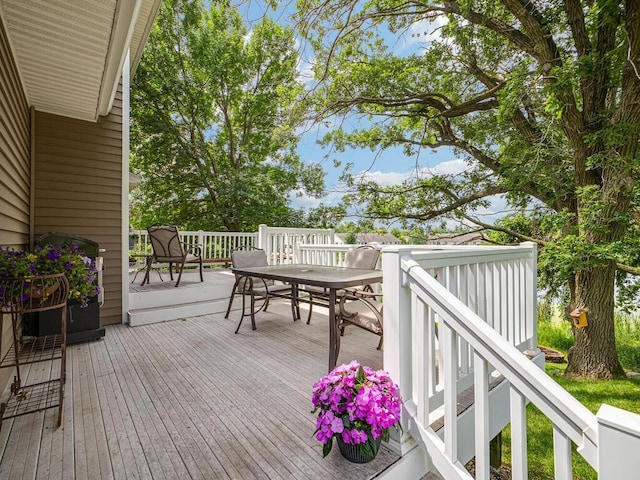 18232 Roosevelt St NW, Elk River, MN 55330 - wooden terrace with outdoor dining area and grilling area