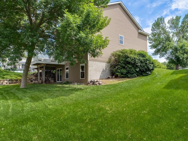 18232 Roosevelt St NW, Elk River, MN 55330 - view of property exterior featuring a lawn and a deck