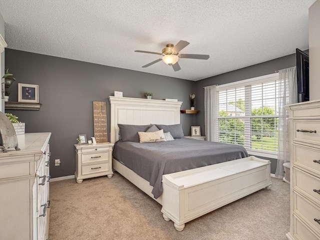 18232 Roosevelt St NW, Elk River, MN 55330 - bedroom with light colored carpet, a textured ceiling, and a ceiling fan