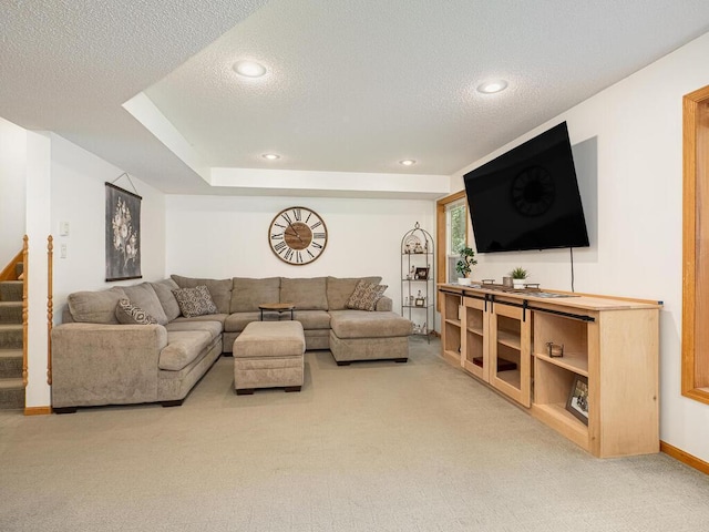 18232 Roosevelt St NW, Elk River, MN 55330 - carpeted living room with a textured ceiling, stairway, and recessed lighting