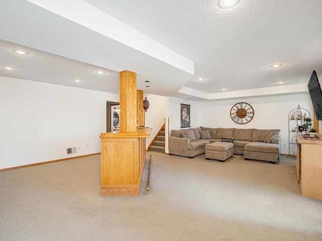 18232 Roosevelt St NW, Elk River, MN 55330 - living area featuring light carpet, recessed lighting, a textured ceiling, and stairs