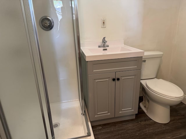 608 Duluth Ave N, Thief River Falls, MN 56701 - bathroom featuring a stall shower, wood finished floors, and vanity