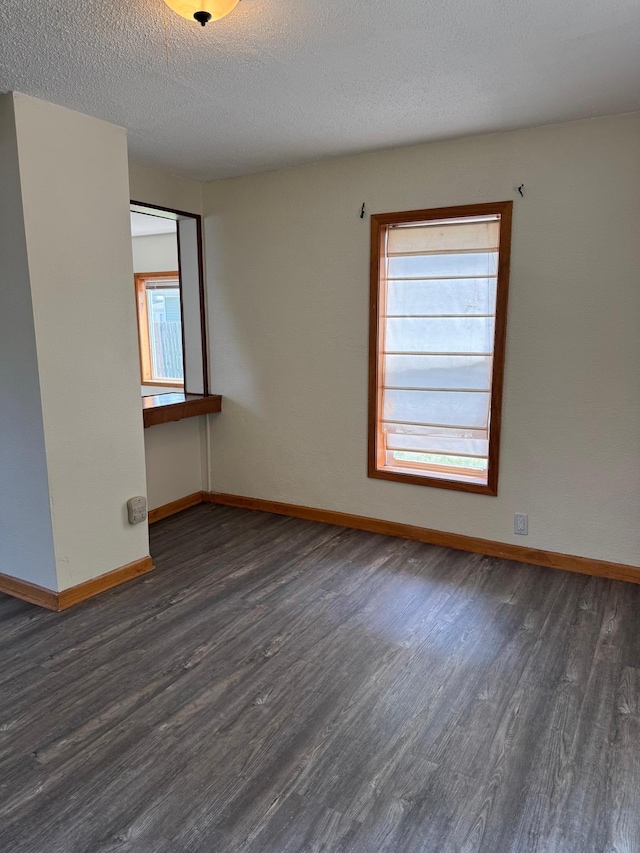 608 Duluth Ave N, Thief River Falls, MN 56701 - unfurnished room featuring wood finished floors and a textured ceiling