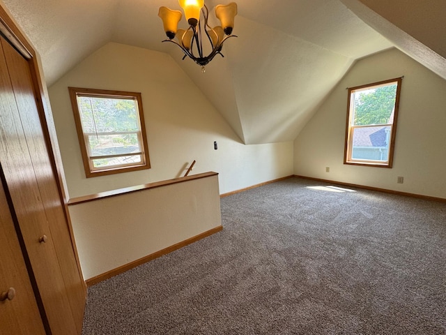 608 Duluth Ave N, Thief River Falls, MN 56701 - bonus room featuring carpet flooring, lofted ceiling, and a chandelier