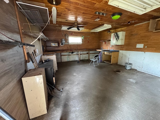 608 Duluth Ave N, Thief River Falls, MN 56701 - garage featuring wood walls and a ceiling fan