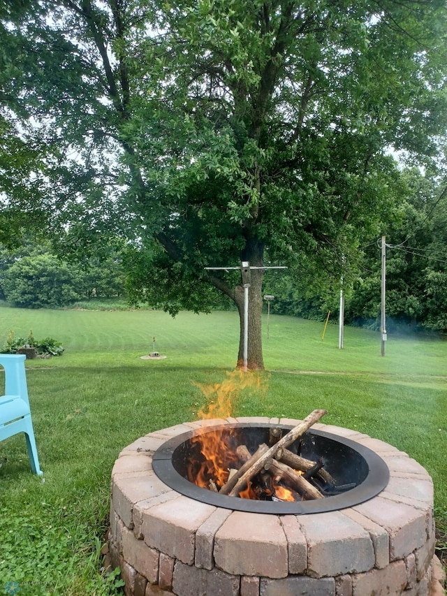 72558 209th St, Collinwood Twp, MN 55325 - view of grassy yard with an outdoor fire pit