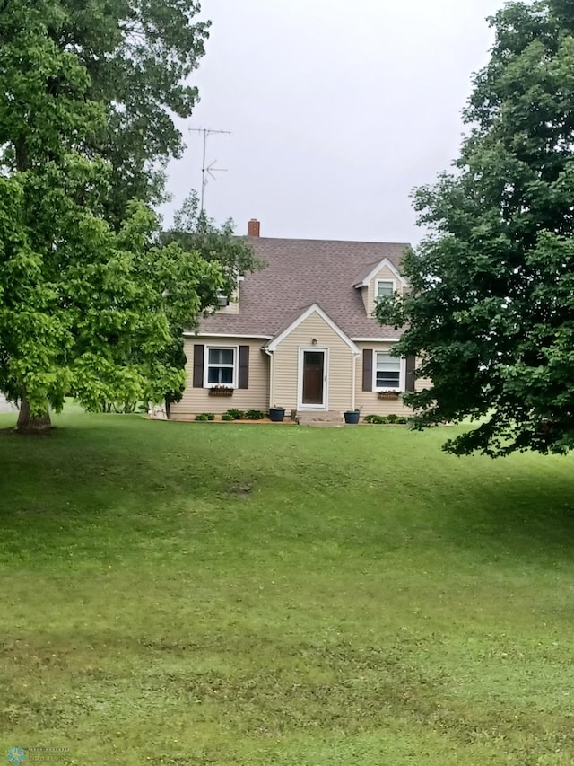 72558 209th St, Collinwood Twp, MN 55325 - cape cod home featuring a chimney, a front yard, and roof with shingles