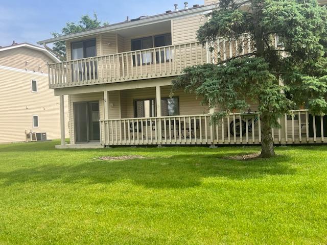 3335 Nevada Ave N Unit 3502, Crystal, MN 55427 - back of house with a balcony and a yard