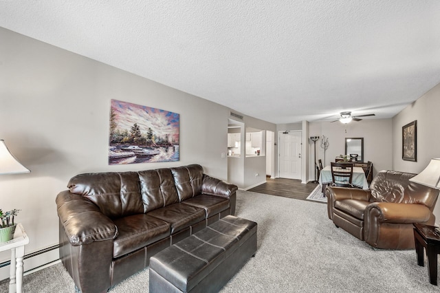 4385 Trenton Ln N Unit 309, Plymouth, MN 55442 - living area featuring carpet, a ceiling fan, baseboard heating, and a textured ceiling