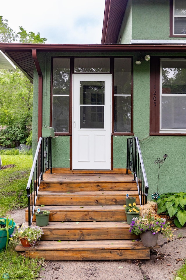 1205 11th St S, Fargo, ND 58103 - doorway to property featuring stucco siding