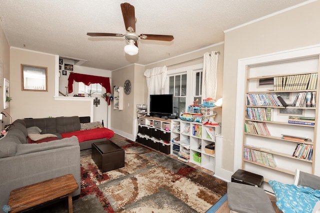 1205 11th St S, Fargo, ND 58103 - living room featuring a ceiling fan, a textured ceiling, ornamental molding, and wood finished floors