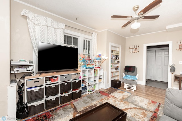 1205 11th St S, Fargo, ND 58103 - living room with wood finished floors, ceiling fan, and ornamental molding