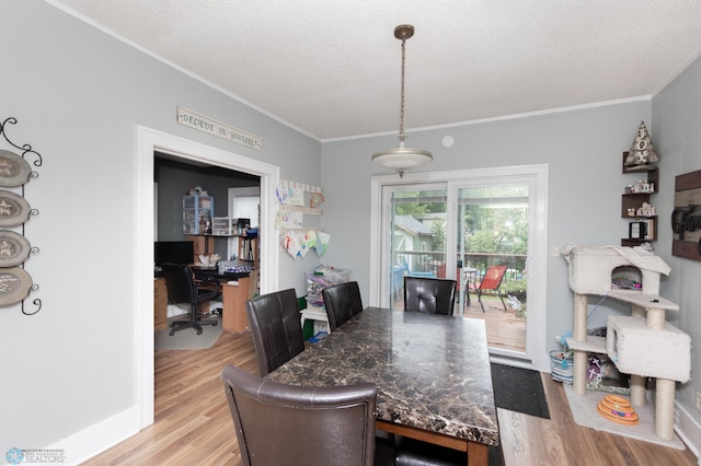 1205 11th St S, Fargo, ND 58103 - dining space with light wood-style floors, ornamental molding, a textured ceiling, and a desk