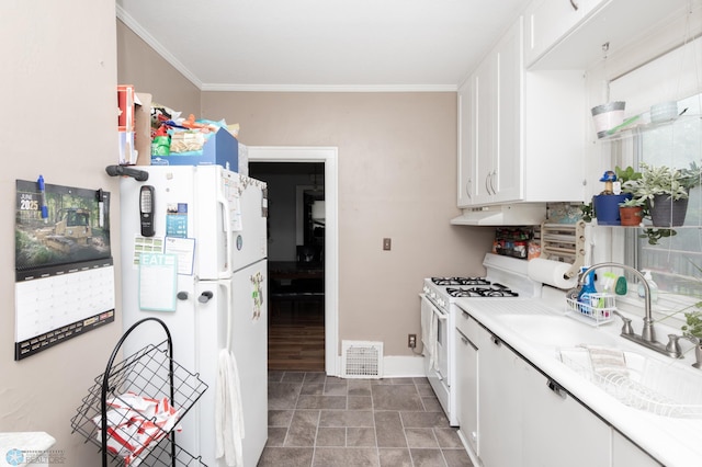 1205 11th St S, Fargo, ND 58103 - kitchen with white appliances, under cabinet range hood, white cabinetry, light countertops, and ornamental molding
