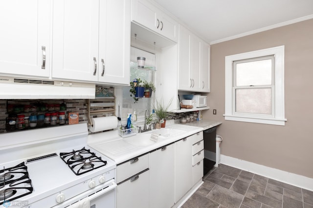 1205 11th St S, Fargo, ND 58103 - kitchen featuring white gas stove, white cabinets, crown molding, light countertops, and backsplash