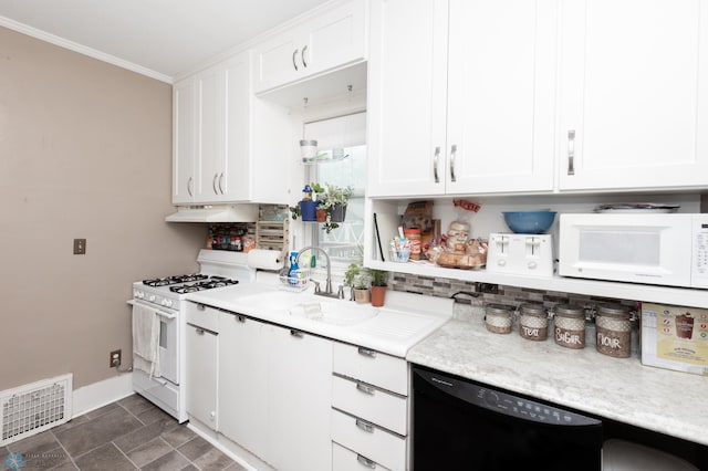 1205 11th St S, Fargo, ND 58103 - kitchen with white appliances, white cabinetry, light countertops, under cabinet range hood, and ornamental molding