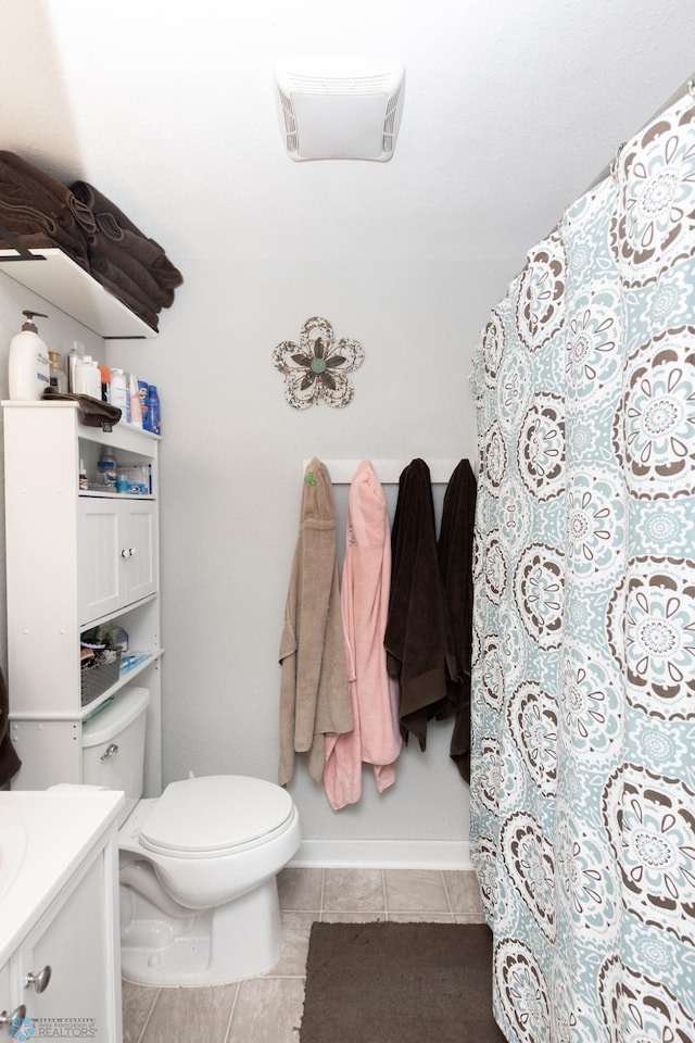 1205 11th St S, Fargo, ND 58103 - bathroom with vanity, tile patterned flooring, and curtained shower