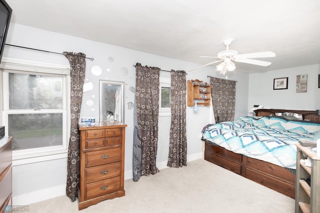 1205 11th St S, Fargo, ND 58103 - carpeted bedroom with a ceiling fan