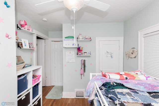 1205 11th St S, Fargo, ND 58103 - bedroom featuring wood finished floors, a closet, and ceiling fan