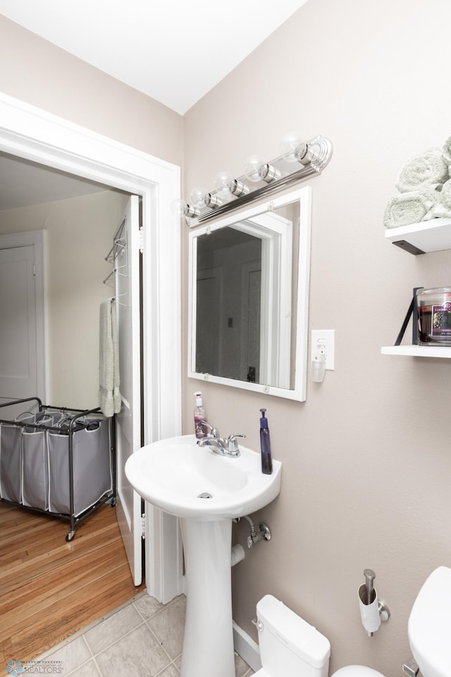 1205 11th St S, Fargo, ND 58103 - bathroom featuring toilet and tile patterned floors