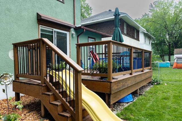 1205 11th St S, Fargo, ND 58103 - view of playground with a deck and a yard