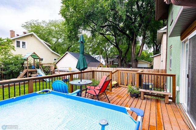 1205 11th St S, Fargo, ND 58103 - deck with a playground and outdoor dining area