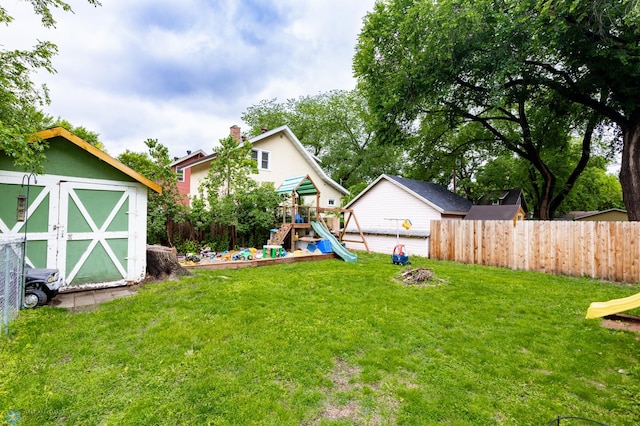 1205 11th St S, Fargo, ND 58103 - view of yard featuring a playground and a storage shed
