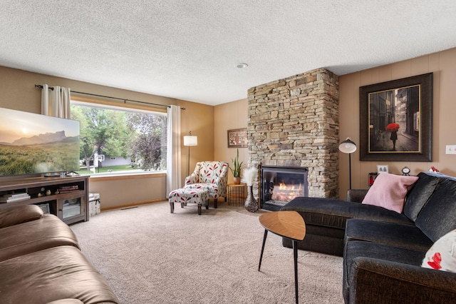 2900 16th Ave S, Moorhead, MN 56560 - living area with carpet floors, a fireplace, and a textured ceiling