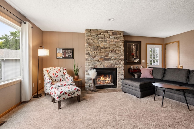 2900 16th Ave S, Moorhead, MN 56560 - living area featuring a textured ceiling, carpet flooring, and a fireplace