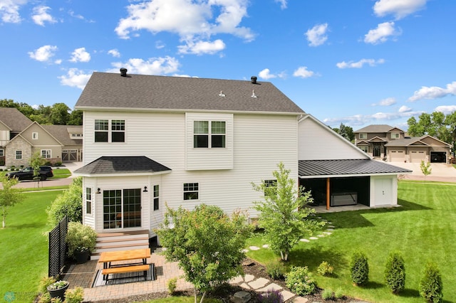 6728 Ashwood Loop, Fargo, ND 58104 - back of property featuring a yard and roof with shingles