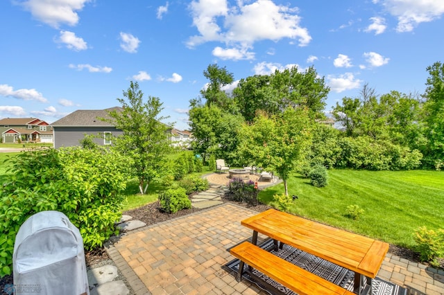 6728 Ashwood Loop, Fargo, ND 58104 - view of patio with an outdoor fire pit and outdoor dining space