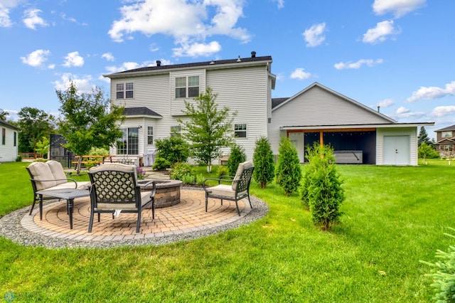 6728 Ashwood Loop, Fargo, ND 58104 - back of property with an outdoor fire pit, a yard, and a patio