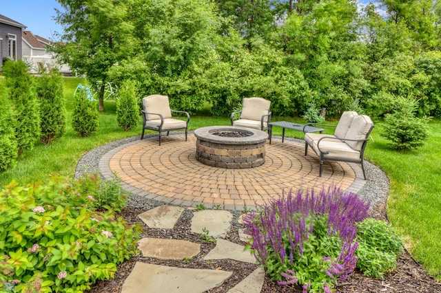 6728 Ashwood Loop, Fargo, ND 58104 - view of patio / terrace featuring a fire pit