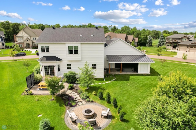 6728 Ashwood Loop, Fargo, ND 58104 - rear view of property with an outdoor fire pit, a lawn, a residential view, and a patio