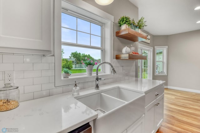 6728 Ashwood Loop, Fargo, ND 58104 - kitchen with tasteful backsplash, open shelves, white cabinets, light countertops, and recessed lighting