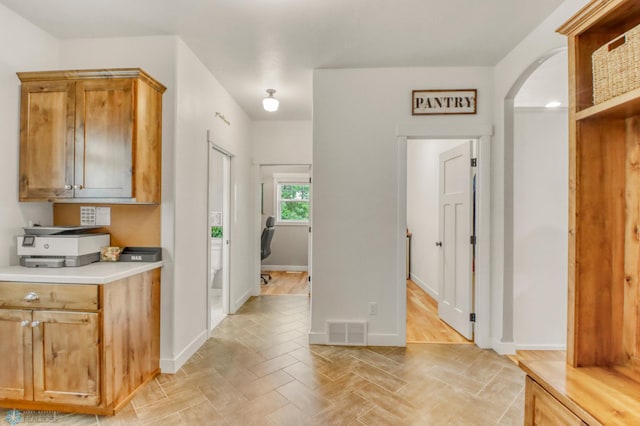 6728 Ashwood Loop, Fargo, ND 58104 - hall with arched walkways and baseboards