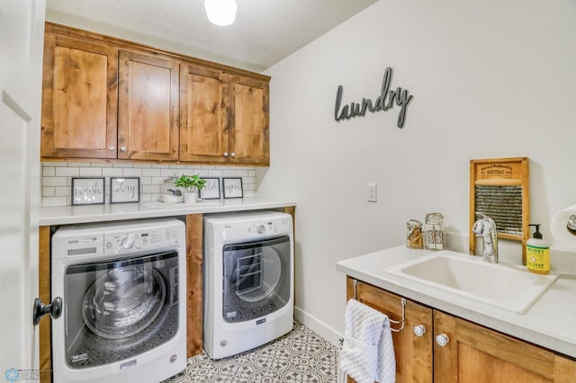 6728 Ashwood Loop, Fargo, ND 58104 - washroom with cabinet space and independent washer and dryer