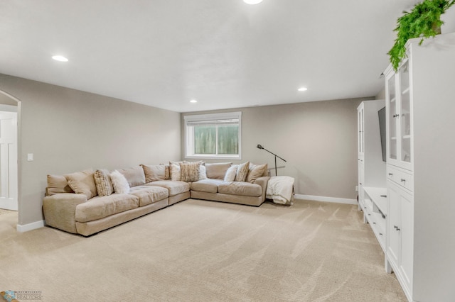 6728 Ashwood Loop, Fargo, ND 58104 - living area with light colored carpet, recessed lighting, and arched walkways