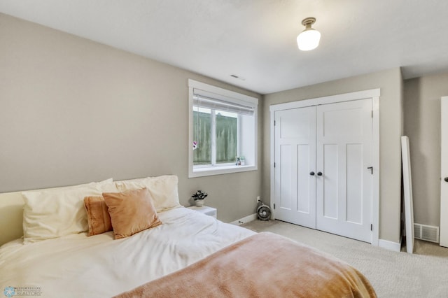 6728 Ashwood Loop, Fargo, ND 58104 - carpeted bedroom featuring baseboards and a closet