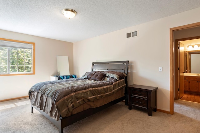 8454 Copperfield Way Unit 75, Inver Grove Heights, MN 55076 - bedroom with light colored carpet and a textured ceiling