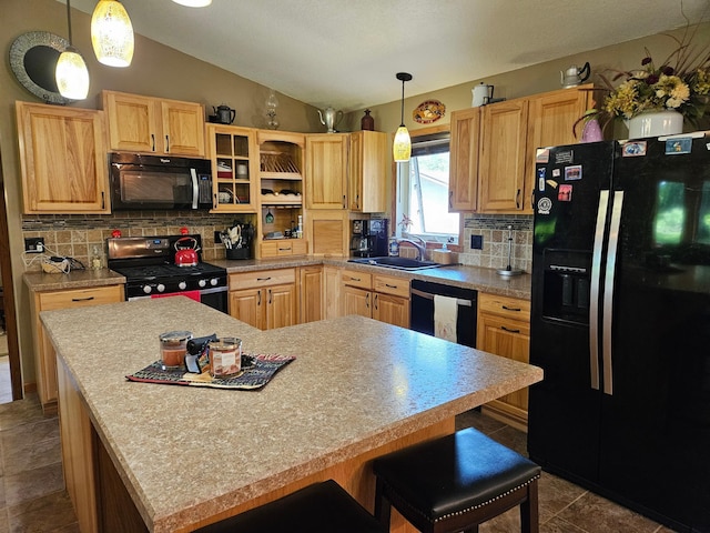 611 3rd St SW, Richville, MN 56576 - kitchen with black appliances, vaulted ceiling, tasteful backsplash, a kitchen bar, and light countertops
