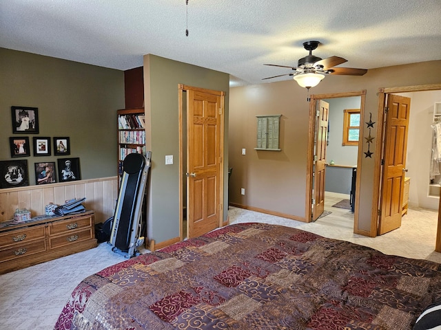 611 3rd St SW, Richville, MN 56576 - carpeted bedroom featuring connected bathroom, a textured ceiling, and ceiling fan